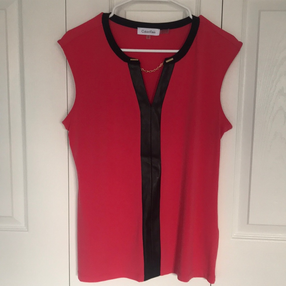 Calvin Klein blouse with faux leather and gold chain detail.
